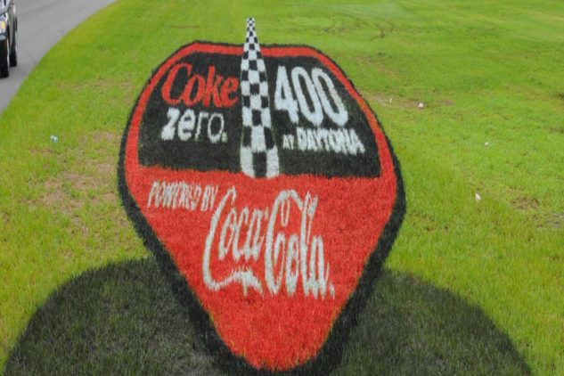 Coca-Cola Zero 3D painted grass logo close-up